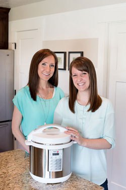 Picture of two women standing behind an Instant Pot