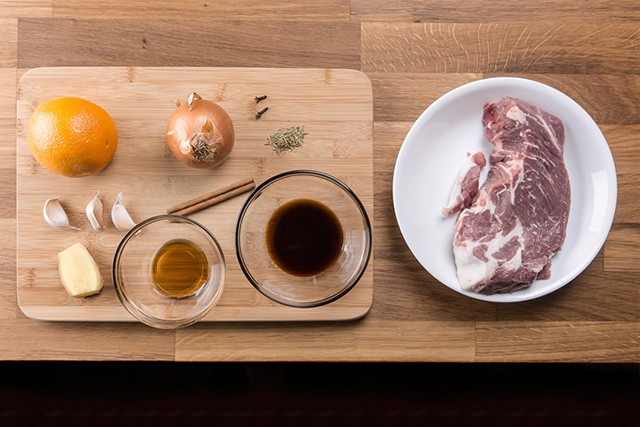 cutting board with ingredients to make an Asian pork roast recipe