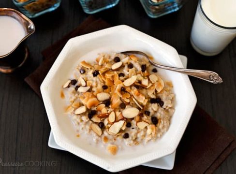 Pressure Cooker (Instant Pot) Almond Joy Steel Cut Oats in a white bowl with a spoon