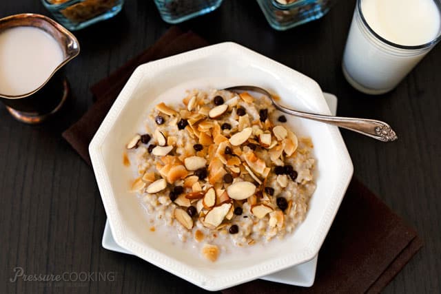 Pressure Cooker (Instant Pot) Almond Joy Steel Cut Oats in a white bowl with a spoon