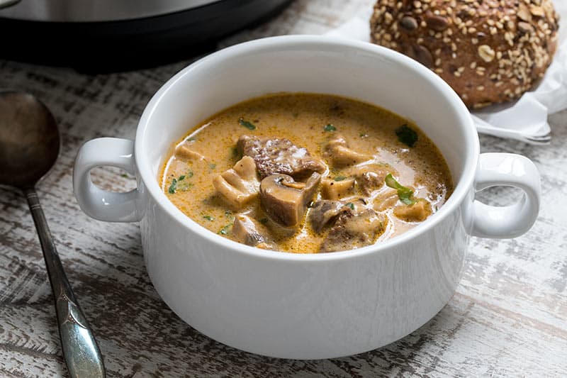 Pressure Cooker Beef and Mushroom Stew in a white bowl