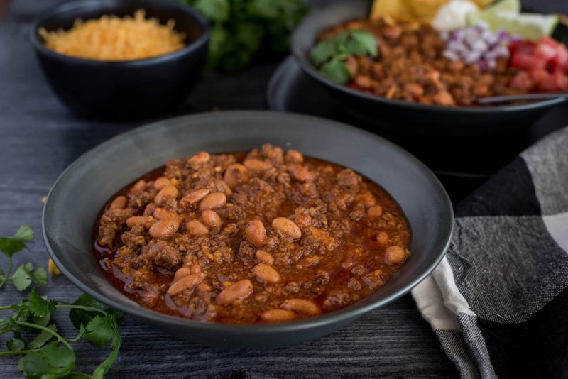 A bowl of Instant Pot chili recipe ready for toppings.
