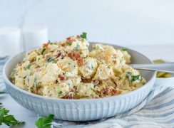 Close up picture of Instant Pot BLT potato salad with fresh parsley in the corner.