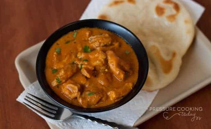 Pressure Cooker ((Instant Pot) Indian Butter Chicken in a black bowl