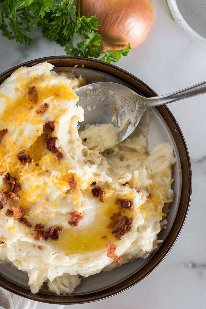 bowl of caramelized onion mashed potatoes with bacon