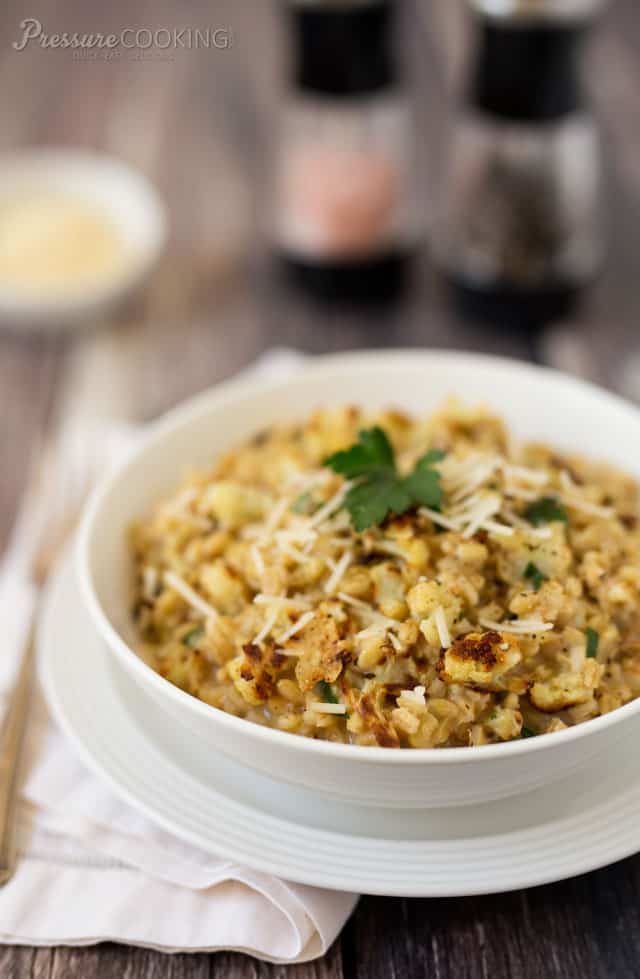 Pressure Cooker Roasted Cauliflower Barley Risotto with Parmesan Cheese in a white bowl