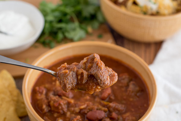 A spoonful of Instant Pot Chili with Beef and Kidney Beans, prepared in the electric pressure cooker