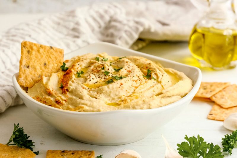 bowl of classic hummus with crackers