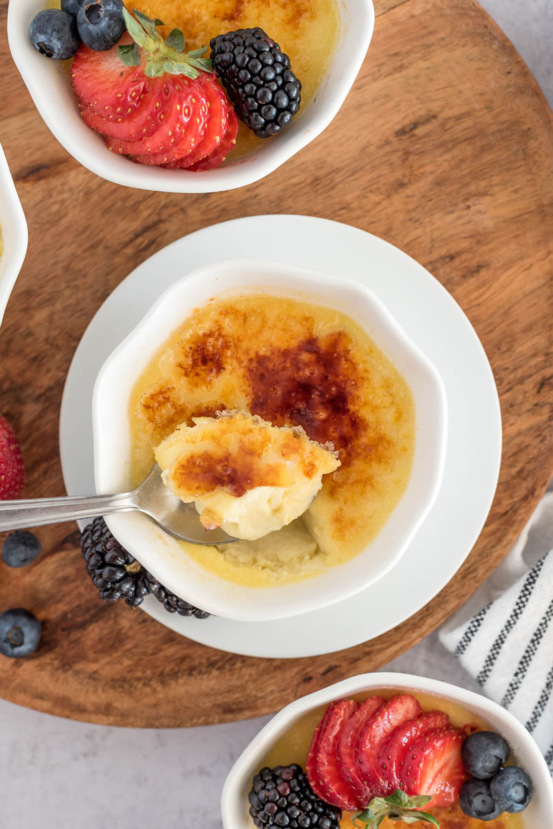 scooping instant pot creme brulee with sugar crust
