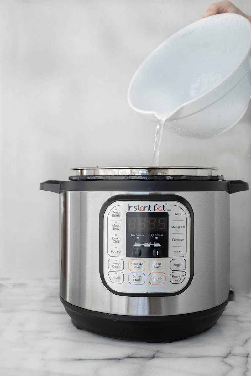 Adding water to an Instant Pot to make dulce de leche