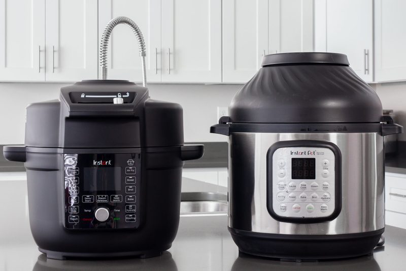 The Instant Pot Duo Crisp with Ultimate Lid next to the Instant Pot Duo Crisp for comparison.