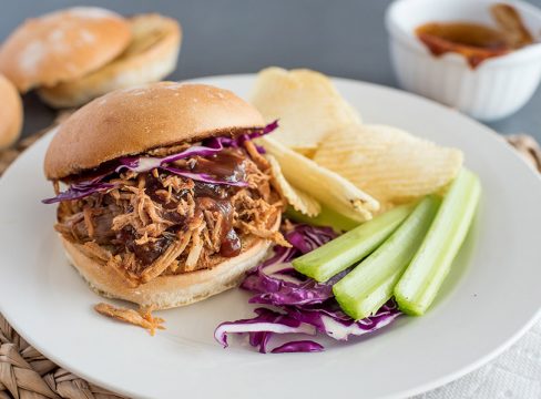 Instant Pot Pulled Pork sandwich, with cabbage, celery, and potato chips