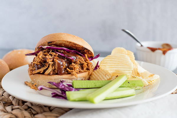 Pressure Cooker Easy Pulled Pork sandwich, with cabbage, celery, and potato chips