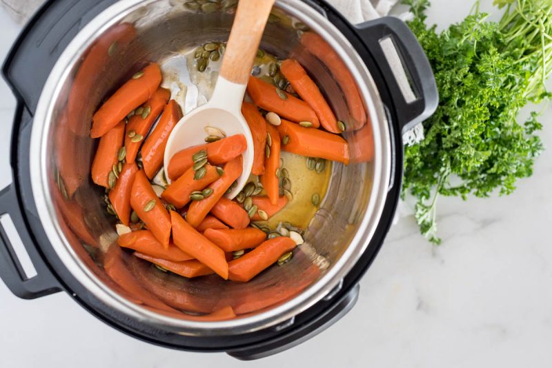 After cooking the Instant Pot carrots, making the glaze, and adding the pepitas