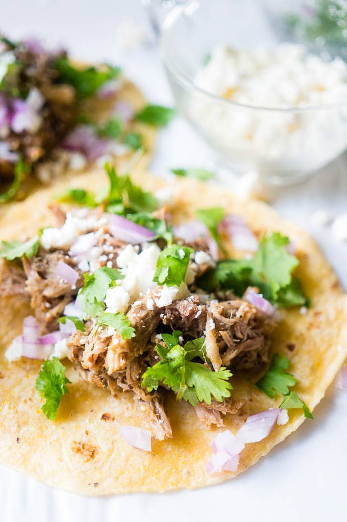 photo of pressure cooked Green Chile Pork Carnitas made into tacos