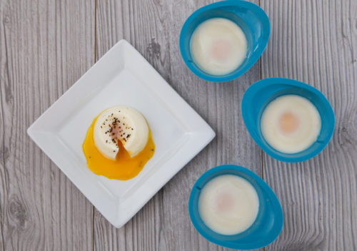 Plated poached egg with three eggs in the silicone egg cups