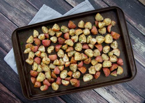 A sheet pan with Instant Pot garlic roasted red potatoes