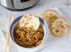 Instant Pot Egg Roll Bowls, dished up in a small bowl and ready to serve with wonton wrappers