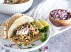 instant pot chili verde in tortillas with lime and chopped red onion