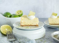 slice of instant pot key lime pie with cream and lime slices on top