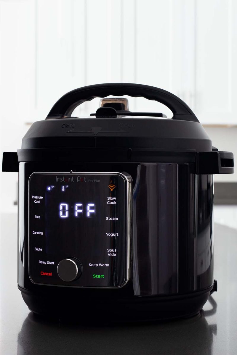 Instant Pot Pro Plus placed on a kitchen counter.