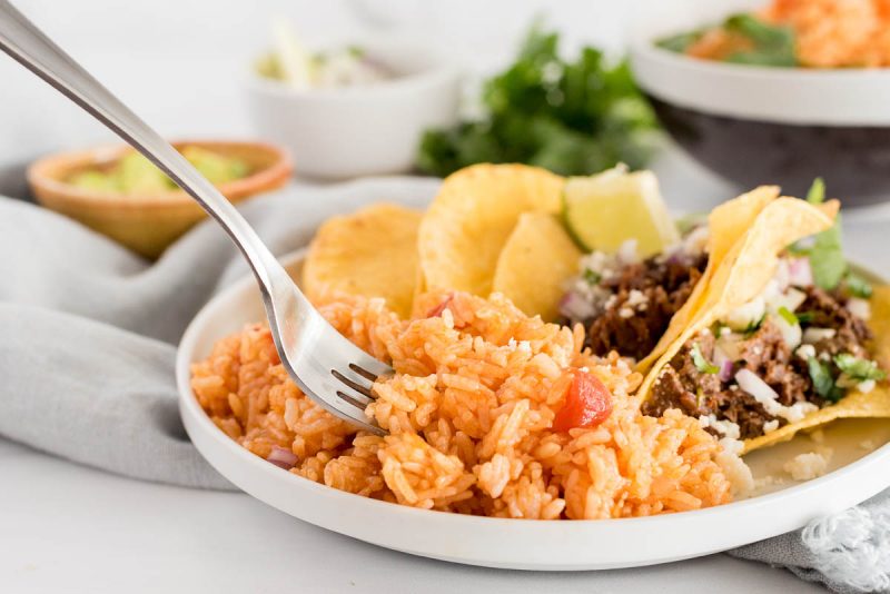 plate of instant pot spanish rice with tacos