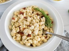 overhead of rosemary bacon mac and cheese in a white bowl