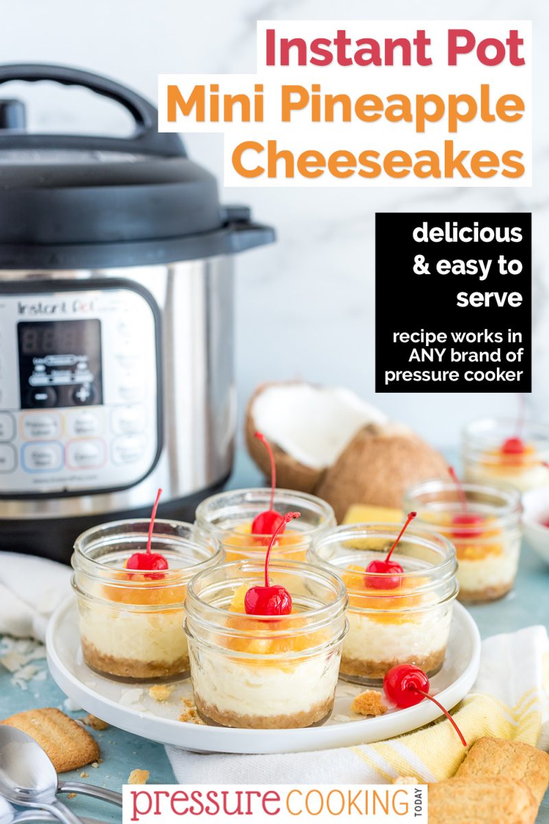 A Pinterest image reading "Instant Pot Mini Pineapple Cheesecakes" featuring a 45 degree shot of four mini mason jars filled with Instant Pot Coconut Cheesecakes, with a sweet pineapple topping and a maraschino cherry on top, with an Instant Pot, coconut, and pineapple visible in the background