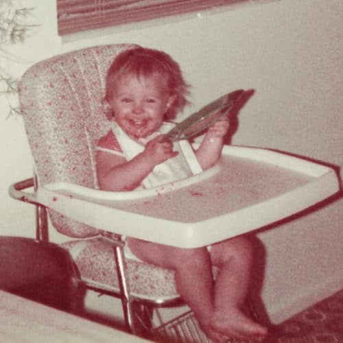 A small child sitting in a high chair