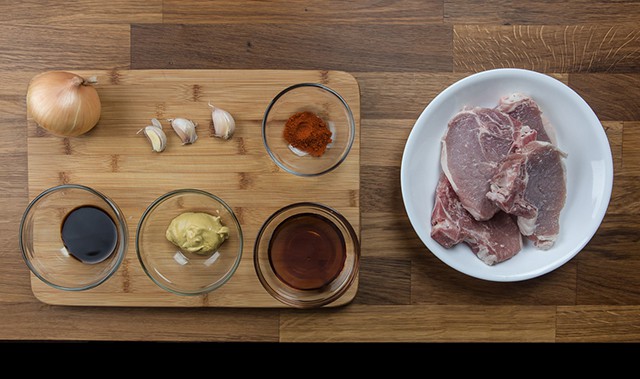 ingredients on a wooden cutting board to make Pressure Cooker Maple Dijon Mustard Pork Chops