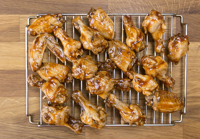 pressure cooked bbq wings on a metal cooling rack