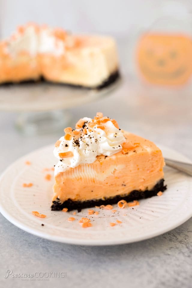 An Orange Marble Cheesecake with an Oreo cookie crust. A luscious dessert perfect for a Halloween party. 