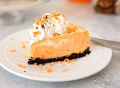 Pressure Cooker (Instant Pot) Orange Marble Cheesecake served on a white dessert plate