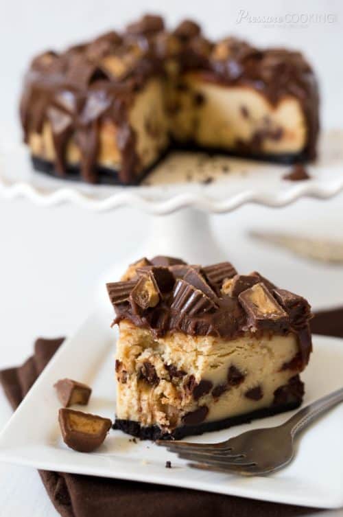 A super smooth, rich, and creamy Pressure Cooker Peanut Butter Cup Cheesecake dripping with chocolate ganache and crowned with chopped peanut butter cups.