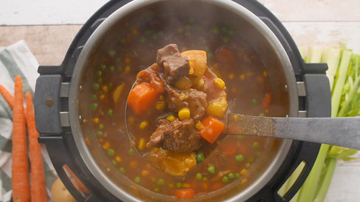 Beef stew recipe for an Instant Pot scooped out and ready to serve.