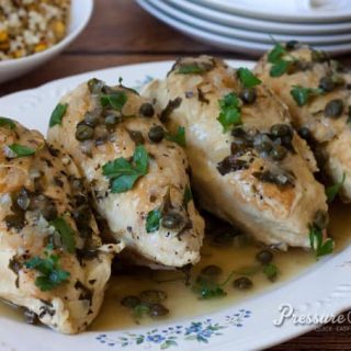 Pressure Cooker (Instant Pot) Braised Chicken with Capers and Parsley on a white serving platter