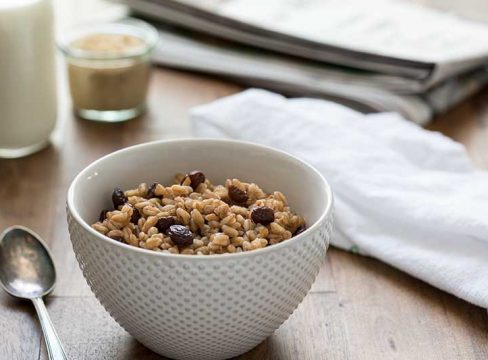 Pressure Cooker (Instant Pot) Brown Sugar Raisin Breakfast Farro served in a white bowl