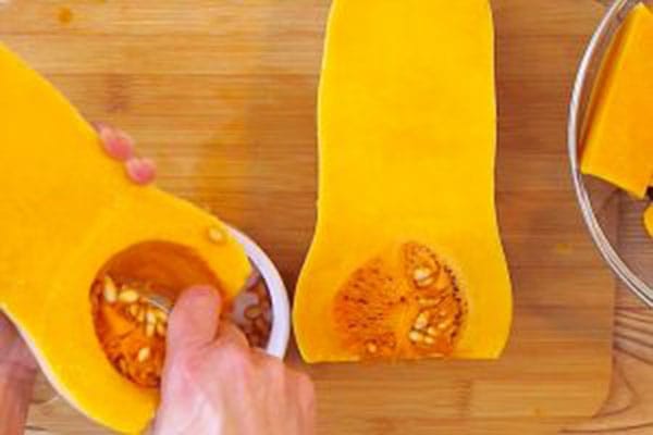 removing the seeds from uncooked butternut squash