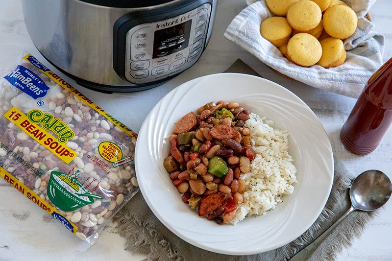 Instant Pot Cajun 15 Bean Soup with Rice and Sausage with corn muffins and hot sauce