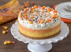 Pressure Cooker (Instant Pot) Candy Corn Cheesecake on a cake stand