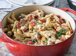 Pressure-Cooker-Chicken-Bacon-Penne-Pasta-In-Garlic-Cream-Sauce served in a red bowl.