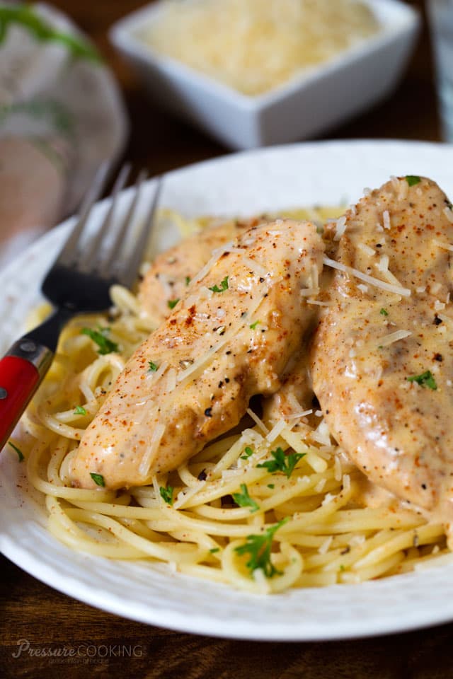 Pressure Cooker (Instant Pot) Chicken Lazone - Seasoned chicken breasts fried in butter, pressure cooked until tender, served over pasta in a decadent cream sauce.