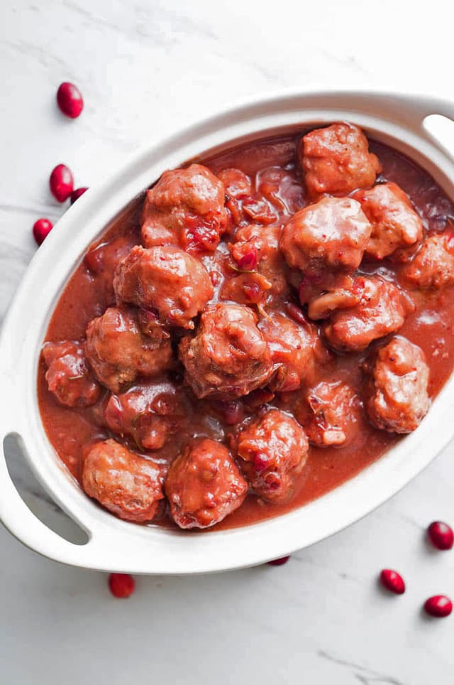 white serving dish filled with Cranberry Balsamic Meatballs made in an Instant Pot