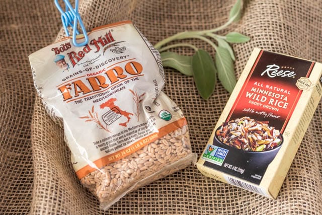 box of Wild Rice mix and bag of Bob\'s Red Mill Farro on a burlap cloth
