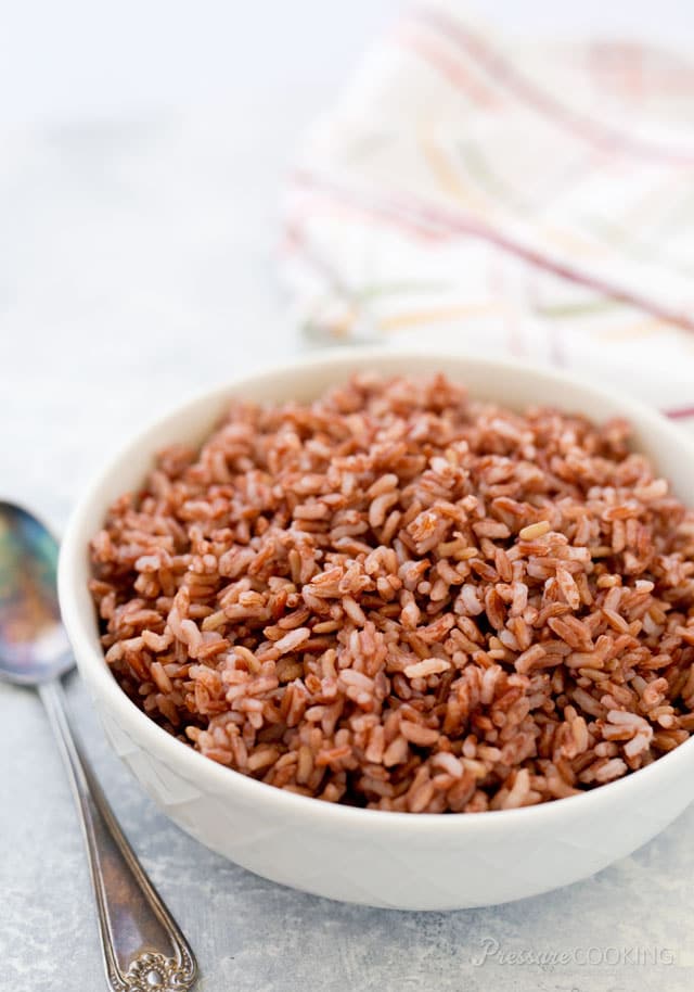 white bowl with fluffy Pressure Cooker made Pink Rice
