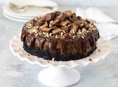 Pressure Cooker (Instant Pot) Nutella Rolo Cheesecake on a cake stand