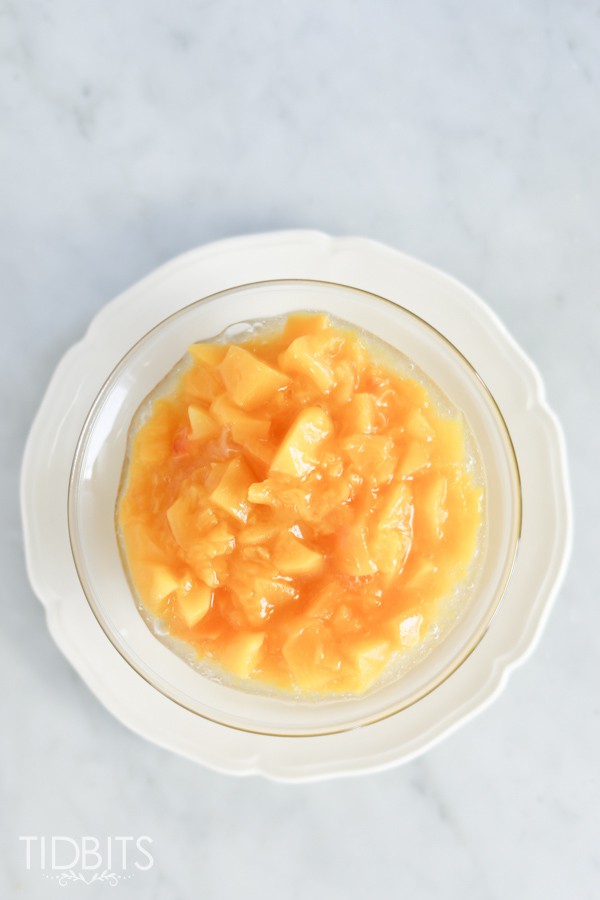 white bowl of Peach Compote made in a pressure cooker