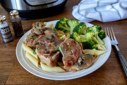 A plate of pork stroganoff and broccoli