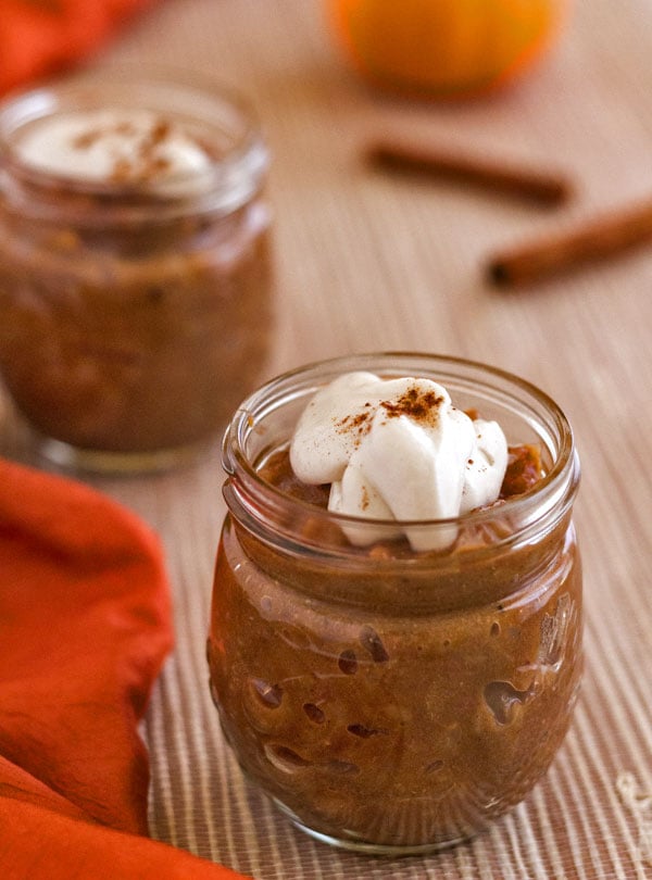 2 mason jars filled with pumpkin date brown rice pudding that was made in an Instant Pot