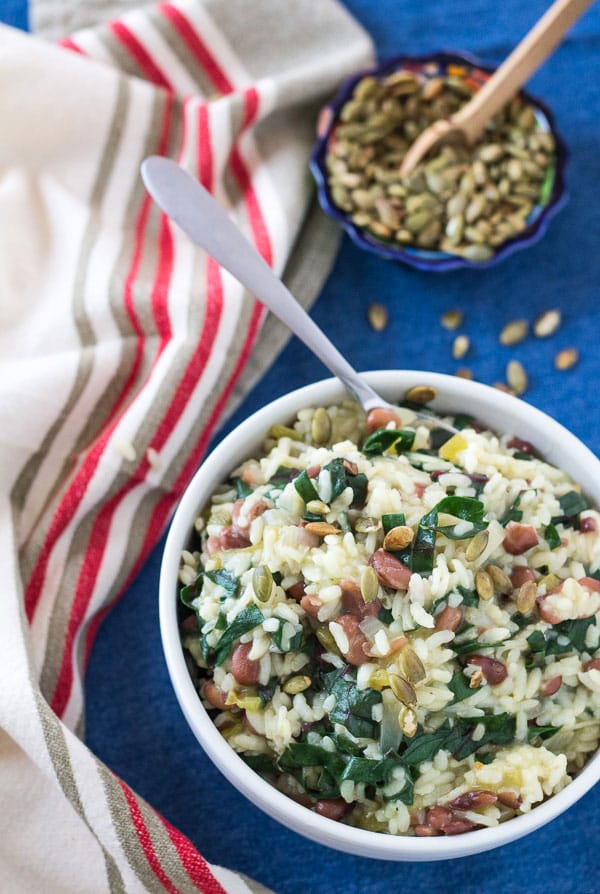 large white bowl filled with Southwest Pinto Bean and Chard Risotto